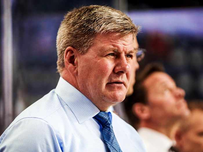 Feb 20, 2019; Calgary, Alberta, CAN; Calgary Flames head coach Bill Peters on his bench during the warmup period against the New York Islanders at Scotiabank Saddledome. Mandatory Credit: Sergei Belski-USA TODAY Sports